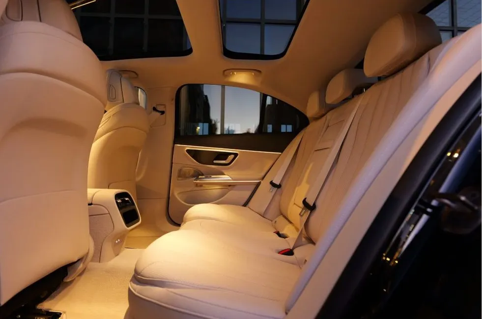 Cream leather rear seats under a panoramic roof